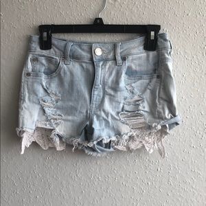 Iight wash denim shorts with lace pockets
